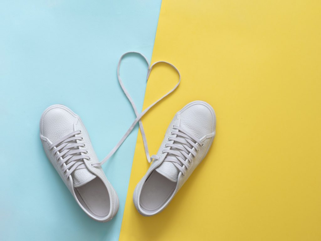 white sneakers with laces in heart shape